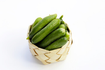 Mini cucumbers on white background.
