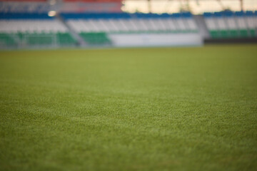 A green soccer field featuring white line markings for soccer games and competitions