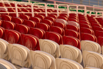 Fototapeta premium Colorful stadium seats in vibrant patterns, creating an inviting seating arrangement