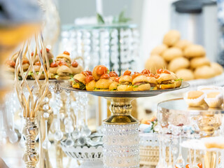 Table with delicious snacks and other desserts