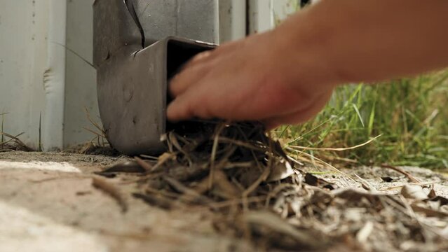 cleaning rainwater pipe from leaves and debris