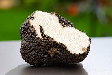 Italian black summer truffle, tasty aromatic mushroom, close up