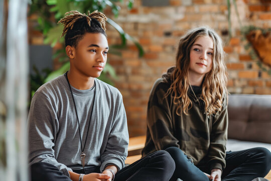 A teenager practicing mindfulness techniques with a youth worker.