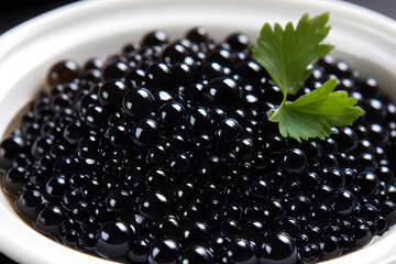 Luxury Delight. Black caviar in a white bowl, garnished with parsley on a dark backdrop