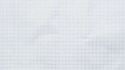 A high-resolution image of an empty squared notebook paper, showing natural creases and texture