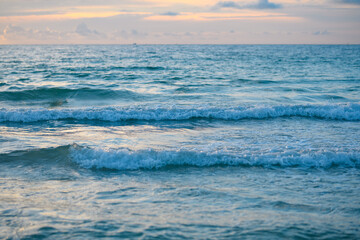 Ocean waves splashing. Ocean waves and beach background. Ocean or sea waves. Sky and clouds background.