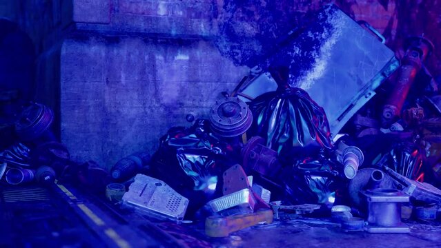 A Pile of Trash Beside a Building, Illuminated by Neon Lights at Night