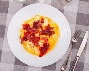 Delicious scrambled eggs with ham - a healthy hearty breakfast