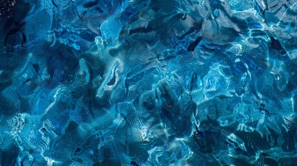 Obraz premium A close-up of water ripples creating an artistic, abstract pattern of light and shadows