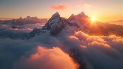 A scenic landscape showing a beautiful sunrise peaking over snow-capped mountains above the clouds