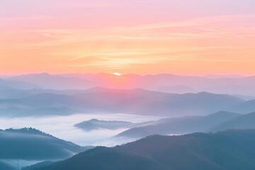 Fototapeta premium sunrise over a misty mountain