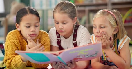 Children, reading book and learning on floor at school, literacy and knowledge for mind development. Girls, kids and storytelling for education, english and literature information on mat for language