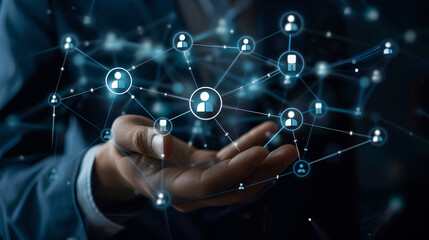 Businessman holding virtual Human Resources network connection icons. Employee Engagement, Talent Management, Workforce Connectivity. Internet business and social network