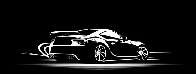 Fototapeta premium A sleek, black sports car in a dramatic silhouette.