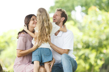 Fototapeta premium Caucasian family parent and their children picnic at the park in morning.