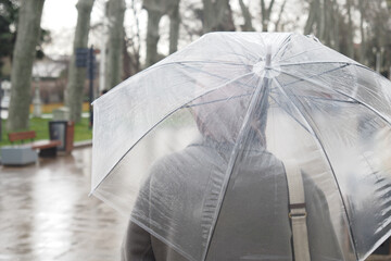 women under umbrella in the rain 
