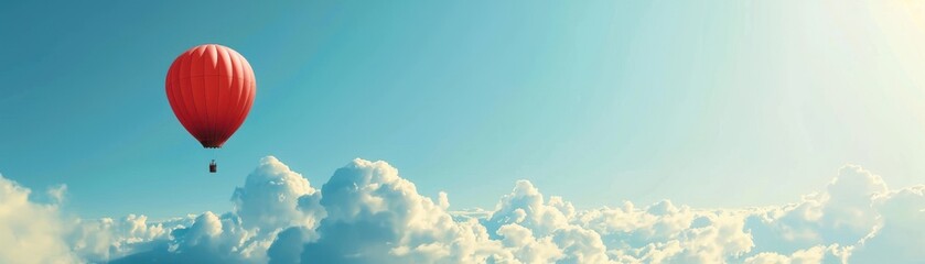 Fototapeta premium A hot air balloon is flying high in the sky above a cloudy backdrop. The balloon is red and white, and it is carrying a person. Concept of adventure and freedom