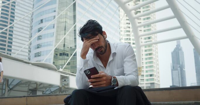 Millennial man face stressed frustration stress burdens carries. Middle eastern person white shirt struggle against unmet expectations and unrealized dreams relentless pressure of world around him.