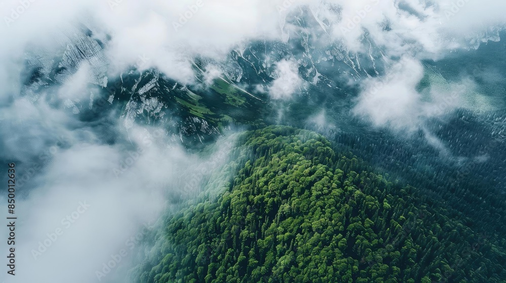 Aufkleber Aerial view of misty green mountains with clouds and fog, creating a serene and mysterious atmosphere. Captured in high definition.