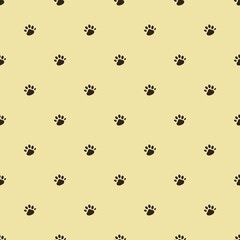 Seamless brown dog footprint pattern with yellow background 