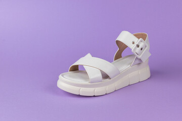 Modern White Platform Sandal on Purple Background Minimalist Fashion Footwear