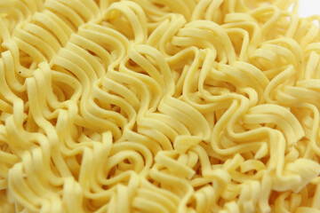 dry noodles, egg noodles texture, abstract background, extreme close up