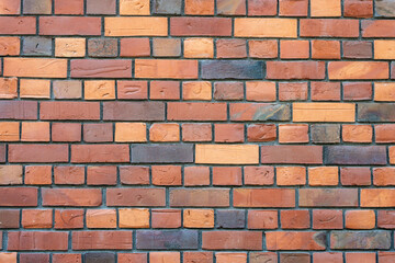 Background from a wall of dark red clinker bricks