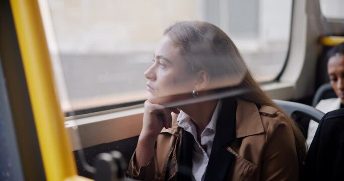 Woman, bus and window thinking for commute journey as corporate intern, public transportation or downtown. Female person, passenger and urban service in Boston city for future, planning or thoughts