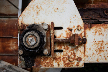 Rusty old mechanical components of industrial machine, detailed close-up photograph