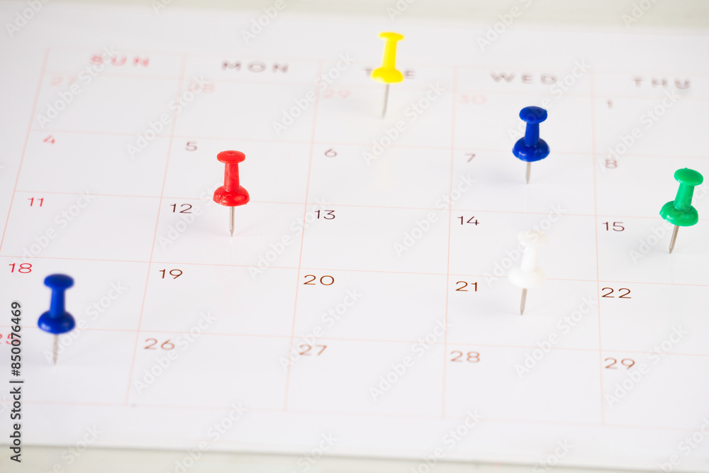 Poster calendar with push pin on the table