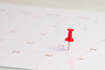 push pin on calendar background