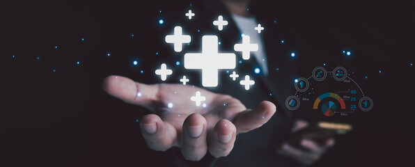 plus sign icon floating in the air on hand It symbolizes the introduction of positive elements such as personal development, social profit, health insurance and a growth mindset.
