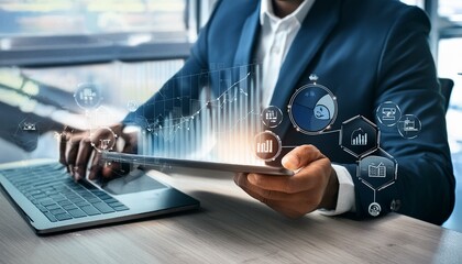 Businessman using tablet and laptop analyzing sales data and economic growth graph chart. Business strategy. Digital marketing. Business innovation technology concept