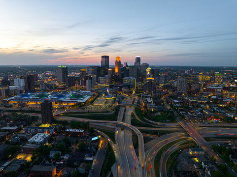 City lights begin to glow across the Minneapolis skyline at dusk