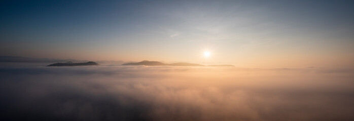 Panorama view. sunrise scene with mist and mountain