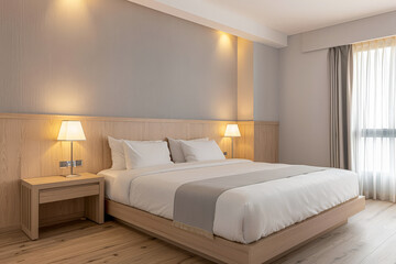 Minimalist modern hotel room in beige tone with natural window lighting. Interiors composition.