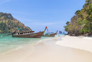 Seascape view with Longtail boats mooring on the beach at Tub island andaman sea Krabi, Thailand