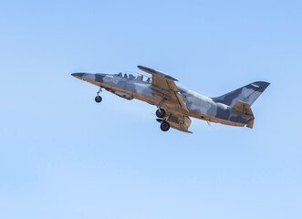 fighter jet military aircraft flying with high speed on blue sky  