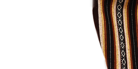 Bright multicolor tablecloth on white background. Fabric texture. Wooden texture. Copy space. Top view