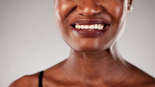 The African American pharmacist provides the woman with nicotine gum to help