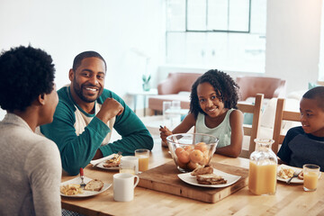 Black family, parents and children for breakfast or eating in home with bonding, relax and happy in dining room. Love, mother and father with kids in morning with food, eggs and bread for nutrition
