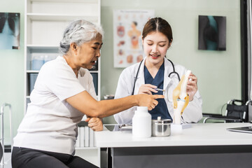 A young Asian female nurse providing healthcare services at her desk, caring for an elderly woman patient. They discuss health checklists and medical advice in a professional setting.