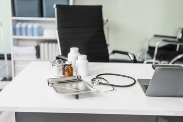 A clean desk with medical equipment, ready for professional use, sits empty, awaiting the next task or appointment.