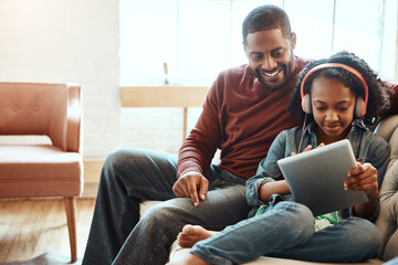 Tablet, man and kid with headphones on sofa for online movie, entertainment and digital network. Happy, black family and relax with technology at home for film, streaming and bonding on fathers day