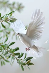 Fototapeta premium A white bird flies near a tree in mid-air, capturing the beauty of nature