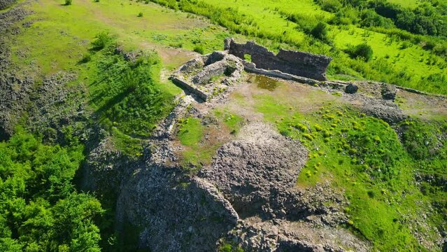 Aerial view of Ruins of ancient Vishegrad Fortress on the southern coast of Studen Kladenets reservoir near town of Kardzhali, Bulgaria
