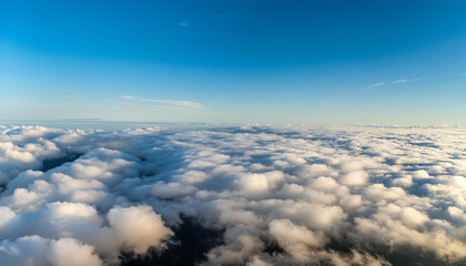 Fototapeta premium Flying through white clouds towards ground visible from distance