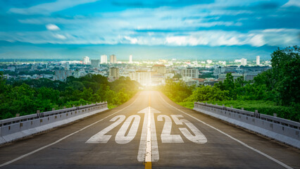The word 2025 on the highway leading into the city. The concept of New Year, travel, a new beginning. Business goals for 2025, etc.