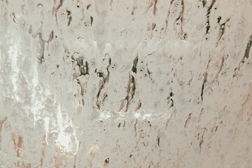 Car glass at a car wash In drops of water. Background