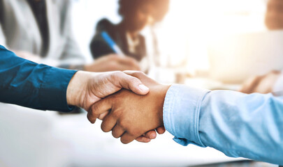 Deal, handshake and partnership with business people in office together for collaboration closeup. Interview, meeting and thank you with employee team shaking hands for hiring, recruitment or welcome